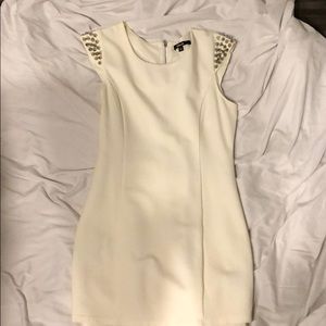 Cream dress with silver shoulder spikes